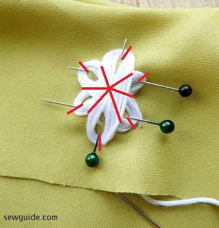 make anchoring stitches on the loops