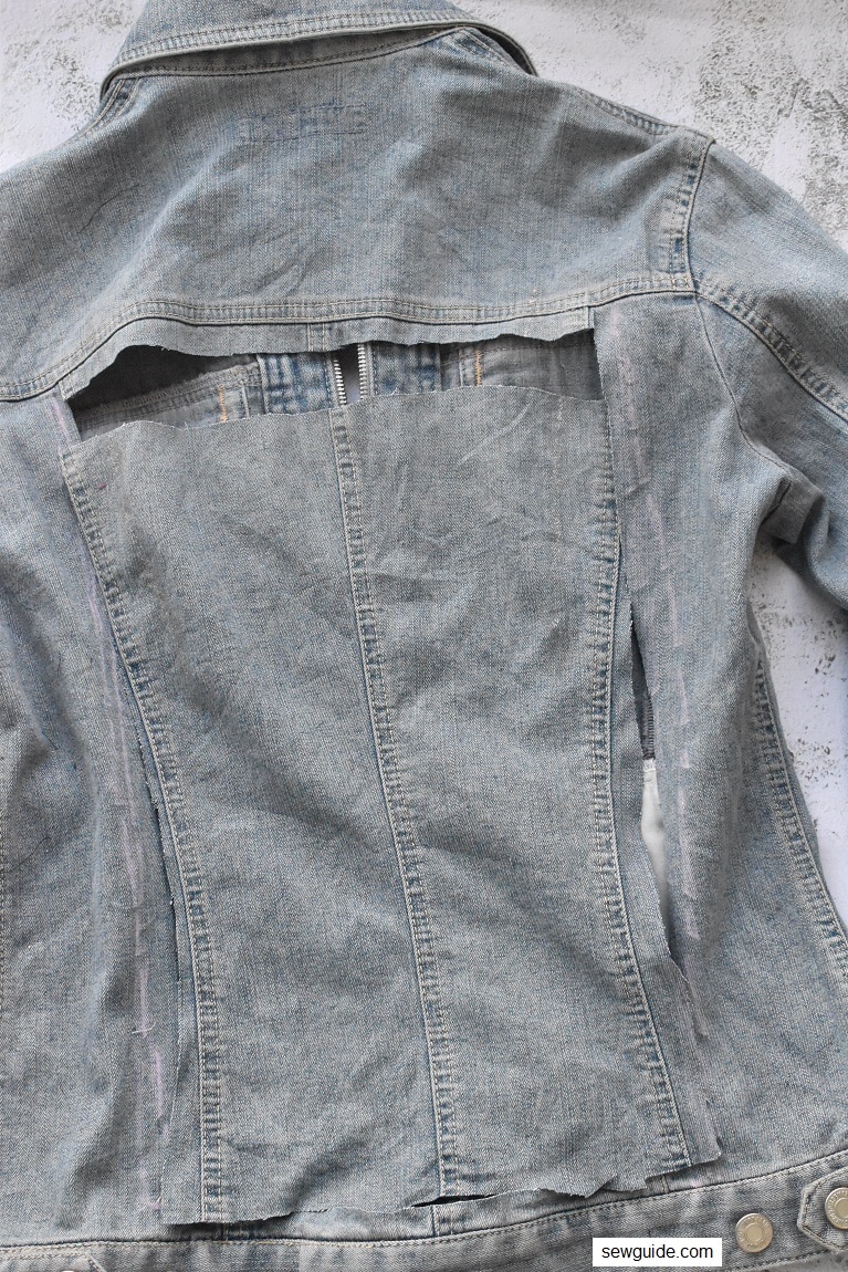 cut out the fabric from the denim jacket