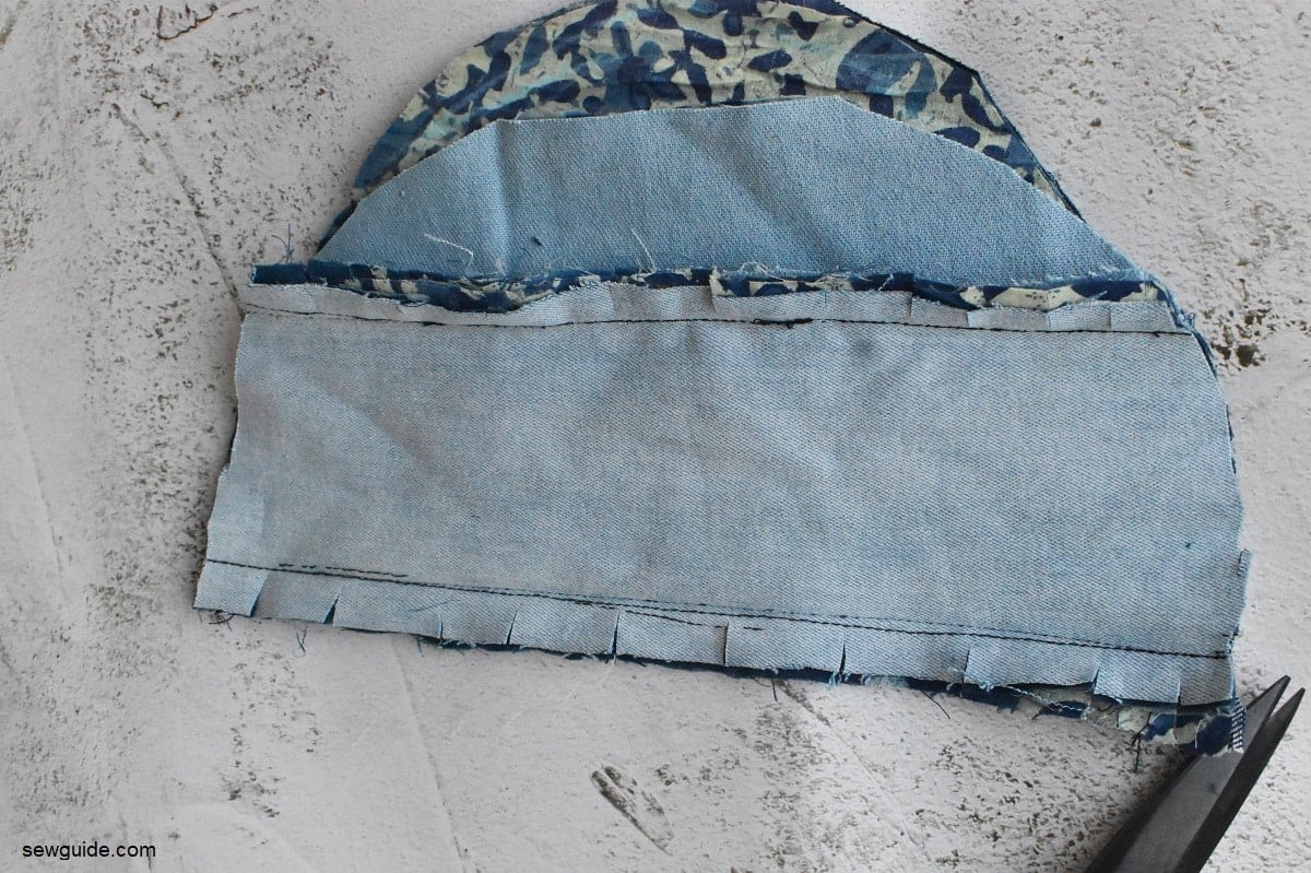 clip the edges of the denim to fray 