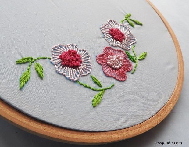 blanket stitches and Frenck knot centers for flower embroidery on bedsheets