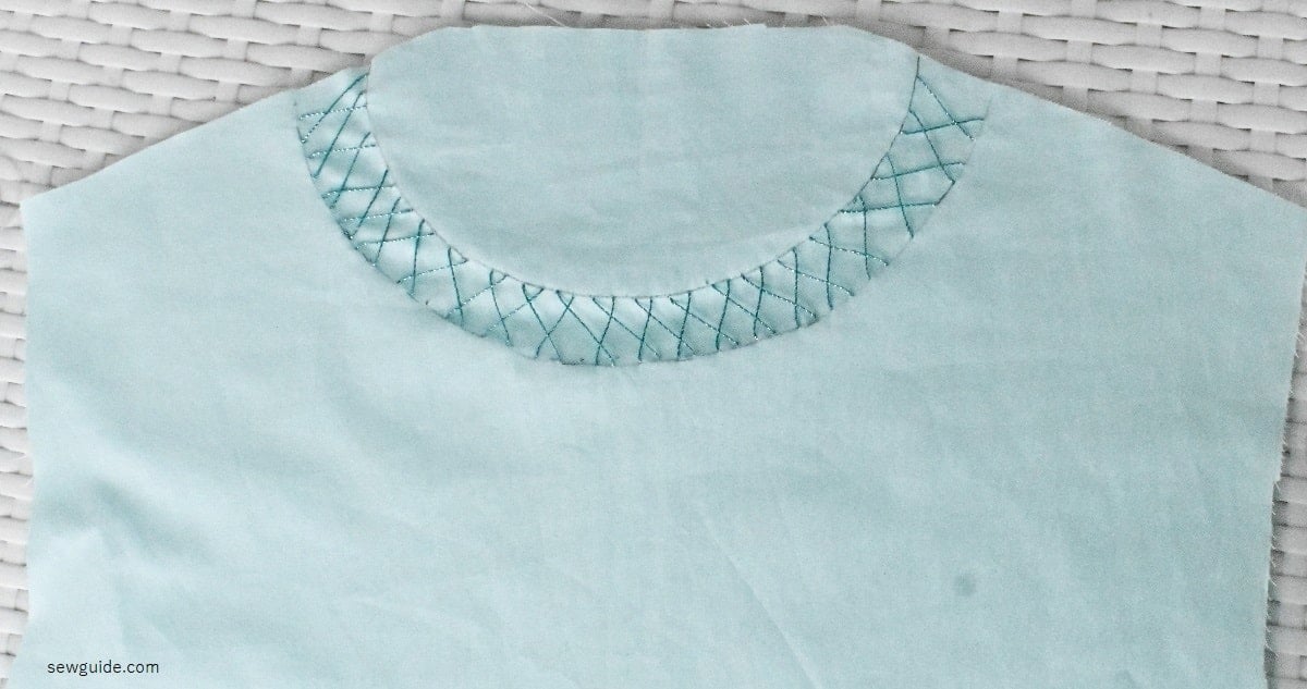 herringbone stitch sewn along the neckline