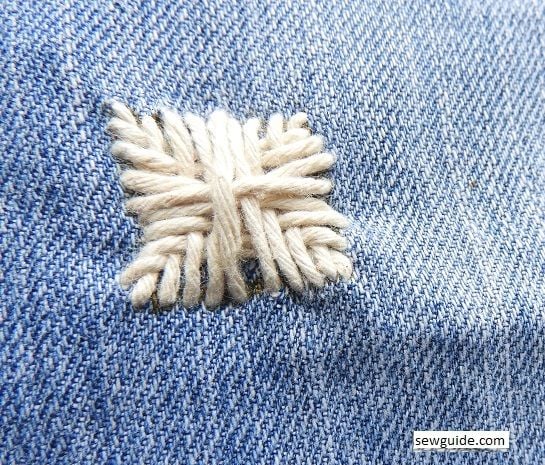 repairing and fixing holes on jeans