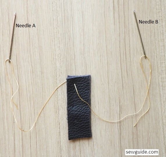 Start sewing the saddle stitch on leather with two needles