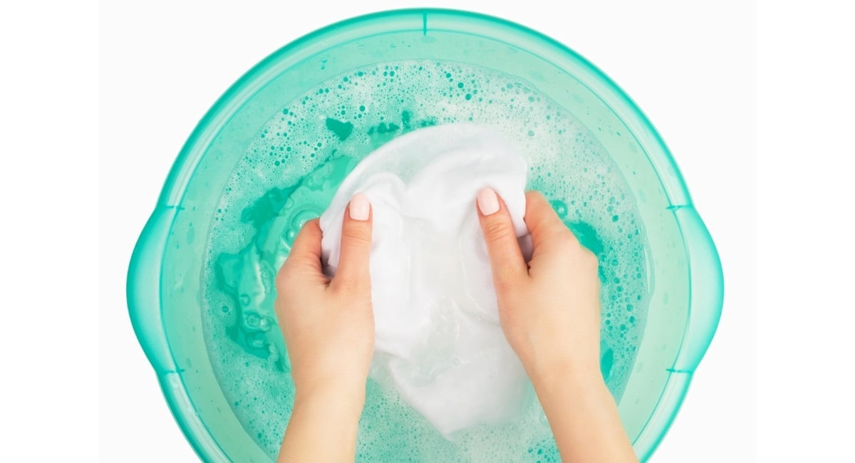 hand washing the fabric for tie dye.