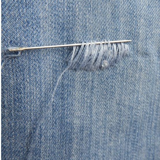 jeans hole mending job