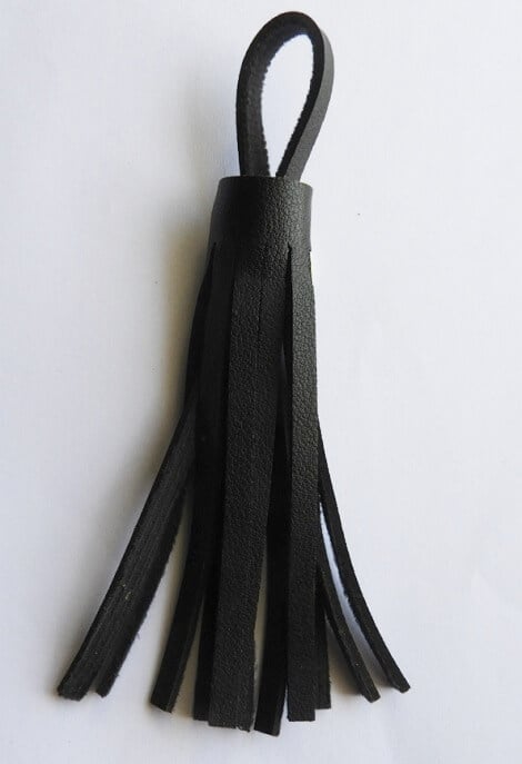 insert the loop of leather inside for making leather tassels