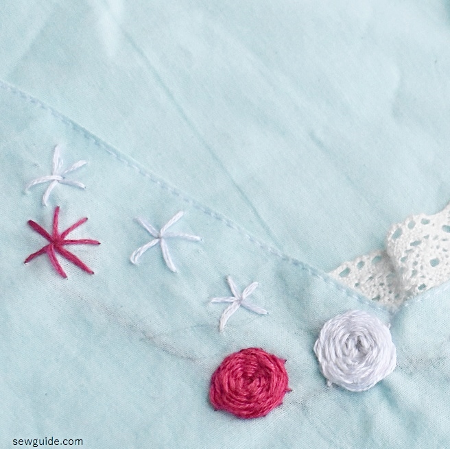 woven rose flowers embroidered on the neckline