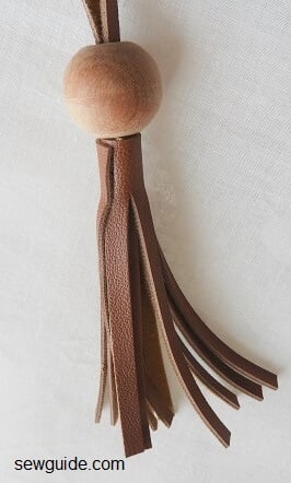 tassel making with large wooden bead