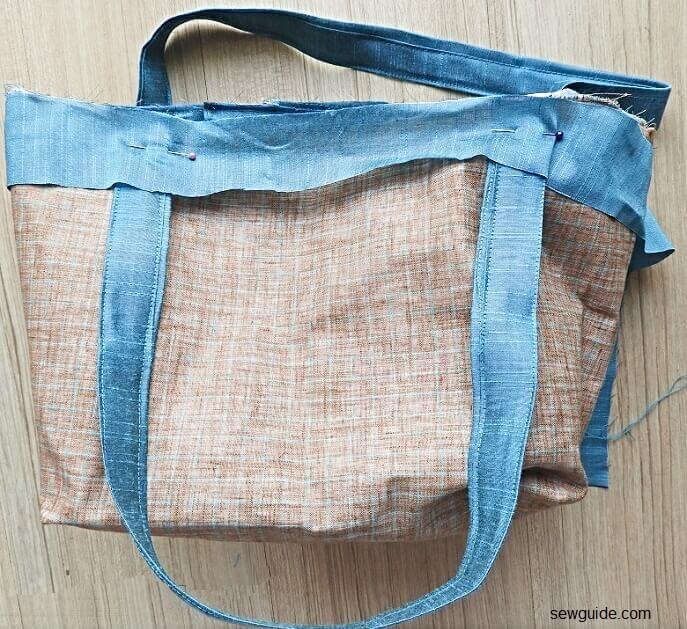 sew the binding to the top edge of the bag